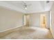 Spacious bedroom featuring a ceiling fan, neutral walls, and access to additional rooms at 111 Trellis Ct, Acworth, GA 30101