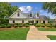Community clubhouse featuring landscaped grounds, grassy lawn, and sidewalks at 111 Trellis Ct, Acworth, GA 30101