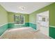 Dining room with two-tone walls and trim, plus a view of the kitchen at 111 Trellis Ct, Acworth, GA 30101