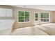Bright kitchen with breakfast bar and view to outdoor deck at 111 Trellis Ct, Acworth, GA 30101