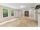 Open living room with multiple windows, French doors, and neutral walls at 111 Trellis Ct, Acworth, GA 30101