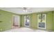 Bright living room featuring neutral carpet, natural light, and entry to another room at 111 Trellis Ct, Acworth, GA 30101