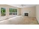 Open concept living room with a fireplace, and deck access at 111 Trellis Ct, Acworth, GA 30101