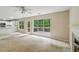 Spacious living room with view to kitchen, windows, and deck at 111 Trellis Ct, Acworth, GA 30101