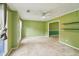 Bright living room with carpet floors, large windows, and a ceiling fan at 111 Trellis Ct, Acworth, GA 30101