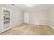 Versatile room with wainscotting and a glass paneled door to the outside at 111 Trellis Ct, Acworth, GA 30101