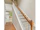 Carpeted staircase with wooden banister and white risers leading to upper level at 111 Trellis Ct, Acworth, GA 30101