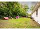 Expansive backyard with play structures and lush greenery, perfect for outdoor activities at 361 N Dogwood N Ave, Social Circle, GA 30025