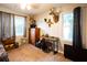 A bedroom featuring natural light, complemented by mounted wildlife decor and carpet floors at 361 N Dogwood N Ave, Social Circle, GA 30025