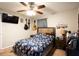 Relaxing bedroom with ceiling fan, wall mounted television, and guitars displayed on the wall at 361 N Dogwood N Ave, Social Circle, GA 30025