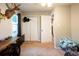 Carpeted bedroom with a double door closet and an adjacent open doorway at 361 N Dogwood N Ave, Social Circle, GA 30025