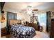 Comfortable bedroom with ceiling fan, dresser, and window with backyard view at 361 N Dogwood N Ave, Social Circle, GA 30025