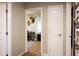 Hallway leading to bedroom with desk and window providing natural light at 361 N Dogwood N Ave, Social Circle, GA 30025