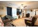 Cozy living room with carpeted floors, ceiling fan, and natural light from the window at 361 N Dogwood N Ave, Social Circle, GA 30025