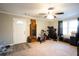 Living room has neutral walls, carpet floors, and a ceiling fan at 361 N Dogwood N Ave, Social Circle, GA 30025
