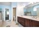 Bathroom boasting a double vanity, tile floor, and separate toilet room at 3641 Mountain Cove Rd, Snellville, GA 30039