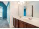 Bathroom featuring a double sink vanity with white countertop and dark cabinets at 3641 Mountain Cove Rd, Snellville, GA 30039