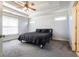Spacious bedroom with a tray ceiling, plush carpet, and natural light at 3641 Mountain Cove Rd, Snellville, GA 30039