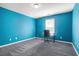 Bedroom featuring blue walls and a carpet floor at 3641 Mountain Cove Rd, Snellville, GA 30039