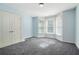 Bedroom with bay window and double door closet at 3641 Mountain Cove Rd, Snellville, GA 30039