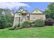 Charming two-story brick home with manicured landscaping and a welcoming front porch at 3641 Mountain Cove Rd, Snellville, GA 30039