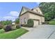 Charming two-story home boasts a brick and siding exterior, complemented by lush landscaping and a private driveway at 3641 Mountain Cove Rd, Snellville, GA 30039