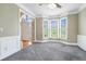 Inviting foyer with a large bay window, neutral paint, and gray carpet at 3641 Mountain Cove Rd, Snellville, GA 30039