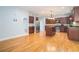 Open concept kitchen featuring an island, stainless steel appliances, and hardwood floors at 3641 Mountain Cove Rd, Snellville, GA 30039