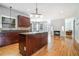 Open concept kitchen featuring an island, stainless steel appliances, and hardwood floors at 3641 Mountain Cove Rd, Snellville, GA 30039