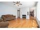 Bright living room with hardwood floors, a fireplace, and large windows at 3641 Mountain Cove Rd, Snellville, GA 30039