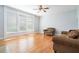 Bright living room with hardwood floors and large windows offering plenty of natural light at 3641 Mountain Cove Rd, Snellville, GA 30039