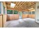 Spacious sunroom with wood walls, skylights and multiple windows to the yard and trees at 3641 Mountain Cove Rd, Snellville, GA 30039
