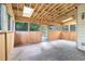 Bright sunroom with wood paneled walls, ample natural light, and views of the backyard at 3641 Mountain Cove Rd, Snellville, GA 30039