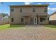 The home has a spacious backyard that offers the perfect setting for outdoor activities and relaxation at 4251 Haywater Cv, Buford, GA 30519