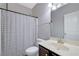 Well-lit bathroom features a shower and tub combo, and a modern vanity with a large mirror at 4251 Haywater Cv, Buford, GA 30519