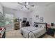 bedroom with natural light from a large window overlooking the yard at 4251 Haywater Cv, Buford, GA 30519