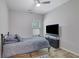 Neutral bedroom features carpet flooring, ceiling fan, and closet space at 4251 Haywater Cv, Buford, GA 30519