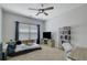 Cozy bedroom with a ceiling fan, tv, and natural light; ready for customization at 4251 Haywater Cv, Buford, GA 30519