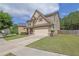 Charming two-story home featuring a two-car garage, well-maintained lawn, and inviting curb appeal at 4251 Haywater Cv, Buford, GA 30519