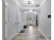 Entry hallway features hardwood floors, archway, white trim, and tall ceilings at 4251 Haywater Cv, Buford, GA 30519