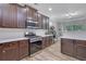 Well-equipped kitchen with modern appliances, ample counter space, and wood cabinets at 4251 Haywater Cv, Buford, GA 30519