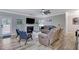 Cozy living room with fireplace, hardwood floors, neutral color scheme, and outdoor access at 4251 Haywater Cv, Buford, GA 30519