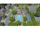 Aerial view of the community pool, clubhouse, and playground, surrounded by well-maintained landscaping at 590 Kyle Trace Ct, Sugar Hill, GA 30518