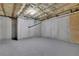Unfinished basement with concrete walls, ready to be transformed into a living space at 590 Kyle Trace Ct, Sugar Hill, GA 30518