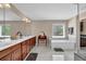 A luxurious bathroom with separate shower, soaking tub, dual sinks and vanity space at 590 Kyle Trace Ct, Sugar Hill, GA 30518
