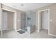 A contemporary bathroom featuring a glass enclosed shower with tile surround at 590 Kyle Trace Ct, Sugar Hill, GA 30518