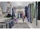 A spacious walk-in closet with ample storage space and organization at 590 Kyle Trace Ct, Sugar Hill, GA 30518