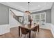 Dining room with stairs leading up to the 2nd floor and lots of natural light at 590 Kyle Trace Ct, Sugar Hill, GA 30518
