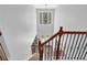 Grand two-story foyer with elegant staircase and abundant natural light streaming through a transom window at 590 Kyle Trace Ct, Sugar Hill, GA 30518