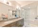 Modern bathroom featuring dual sinks, glass shower, and subway tile at 1100 Howell Mill Nw Rd # 312, Atlanta, GA 30318